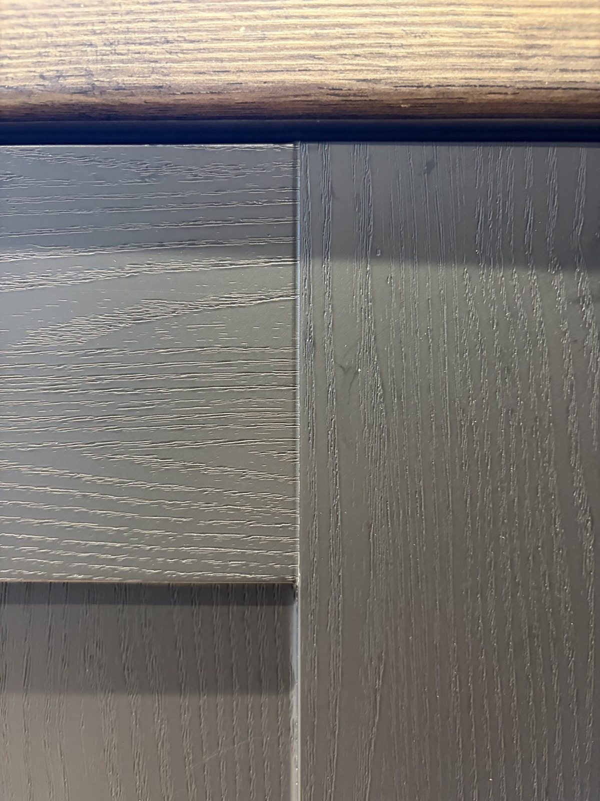 Black wood effect kitchen wrap - edge detail · Cambridge