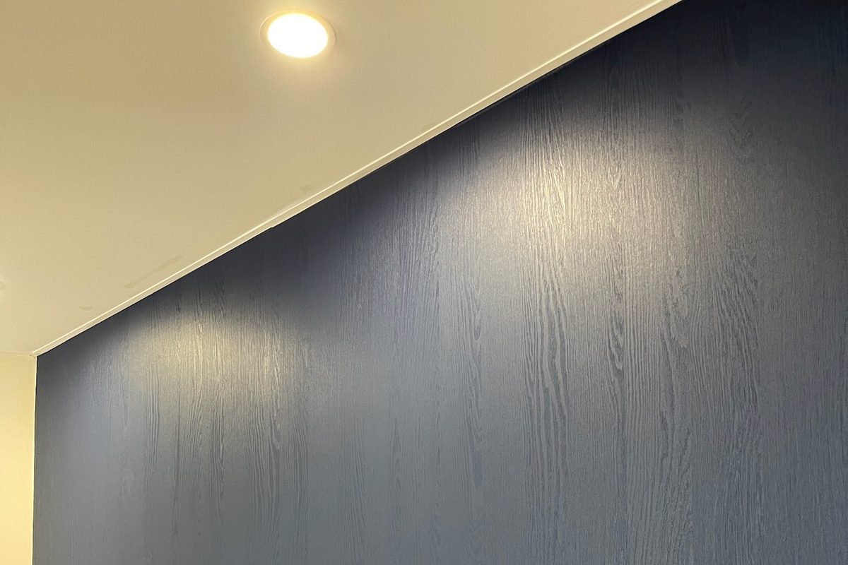 Reception wall wrapped with blue wood effect vinyl Cambridge