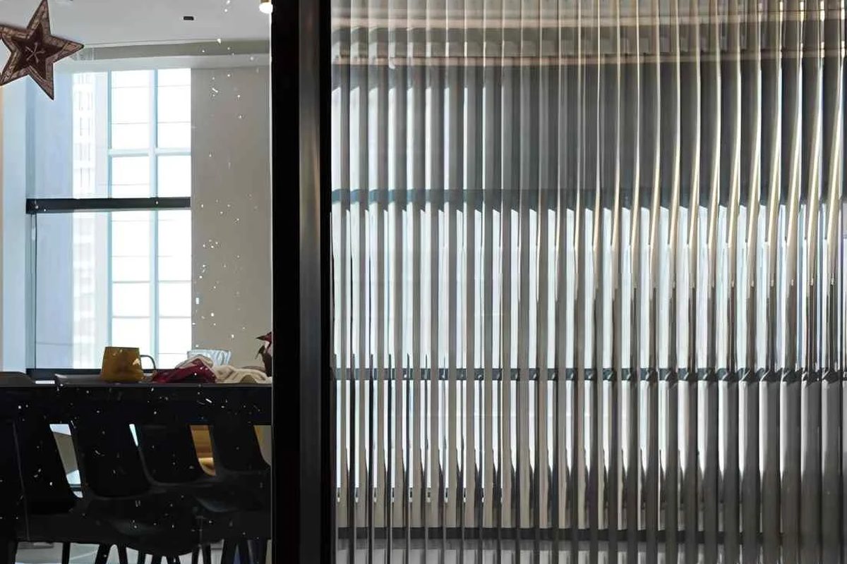 Reeded glass effect film on office partition